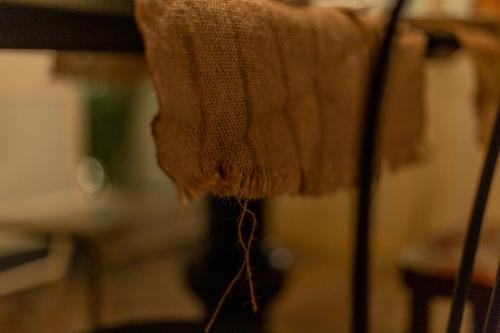 a close up of a towel hanging from a table at Ladiri - Antica dimora in terra cruda in Sìnnai