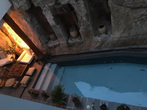 an overhead view of a swimming pool in a building at CASA PORTALICO in Jérica