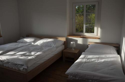 Apartmány U Soptíkaにあるベッド