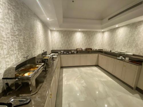 A cozinha ou cozinha compacta de Temandra Hotel