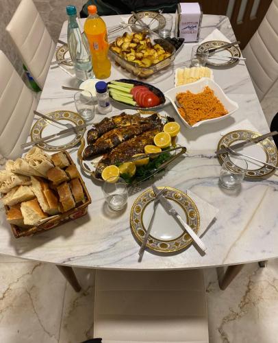 a table with a bunch of food on it at Hotel Sharl in Ninotsminda