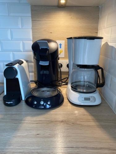 a coffee maker and a blender on a counter at Maison de Marcel Big house near centre free parking in Bruges