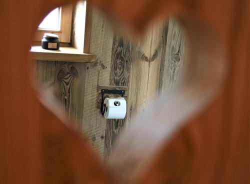 a view through a hole in a wall with a camera at Superior Suite Bergparadies Sauna - barrierfree in Inzell