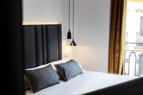 Una cama o camas en una habitación de Madrisol
