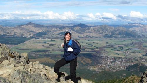 a woman standing on top of a mountain at Hanmer Backpackers in Hanmer Springs