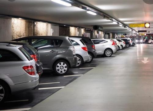 a group of cars parked in a parking garage at Departamento Centro Osorno in Osorno