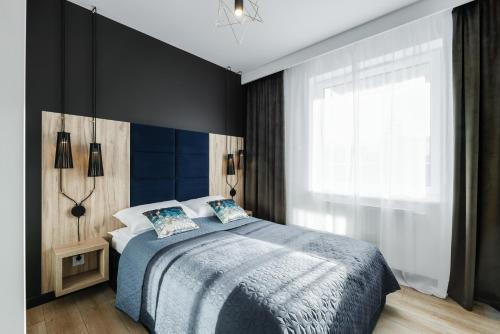 Posteľ alebo postele v izbe v ubytovaní Apartament Słoneczniki Cieplice