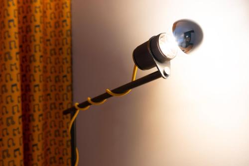 a light that is attached to a wall at ibis Styles Nancy Centre Gare in Nancy