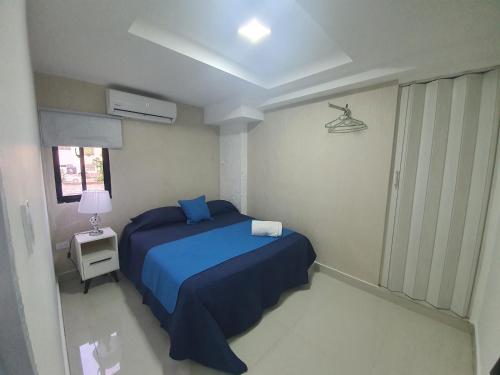 Postel nebo postele na pokoji v ubytování Malecon Rooms y Hotel