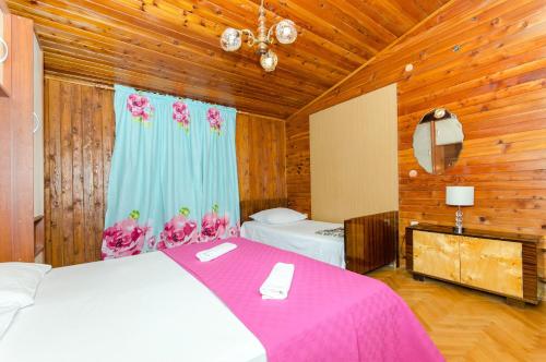 Postel nebo postele na pokoji v ubytování Apartment and Rooms Ivan