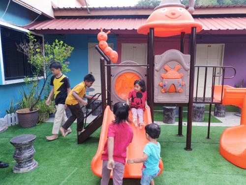 a group of children playing on a playground at TC Maya Abaya Hotel in Kuantan