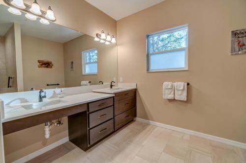 a bathroom with two sinks and a large mirror at Short term vacation rental luxury B&B CTH in Englewood