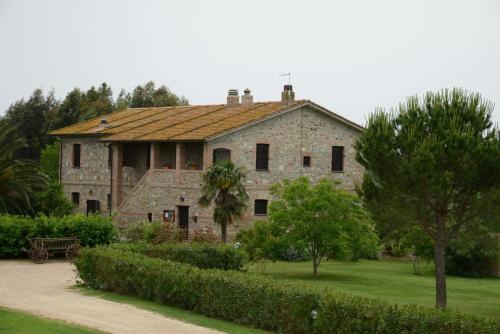 
a large white building with a large window at Agriturismo Volta Di Sacco in Grosseto
