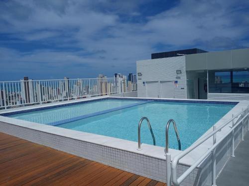 a swimming pool on the roof of a building at Espetacular Flat Miramar 3 in João Pessoa