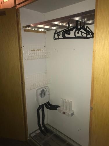a room with a hair dryer on the wall at Ferienwohnung im Chalet Boubou in Wiler