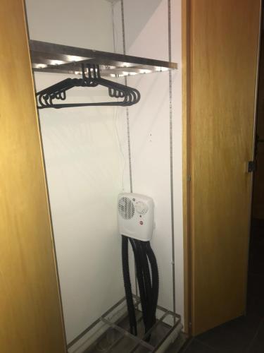 a room with a hose hanging from a wall at Ferienwohnung im Chalet Boubou in Wiler