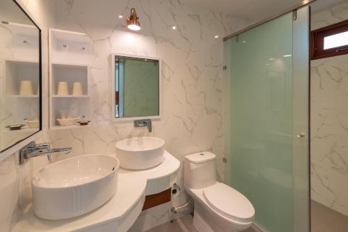 a bathroom with a sink and a toilet and a shower at Wandee Garden in Koh Samui 