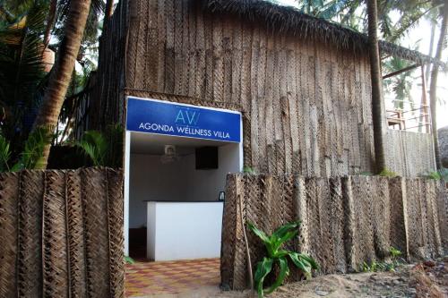 a sign in front of a building with a sign at Agonda Wellness in Agonda