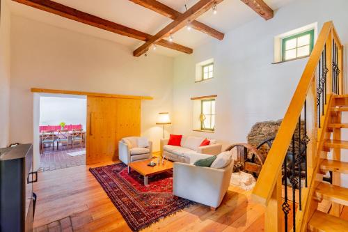 a living room with a couch and a table at Mühle in der Pferdewelt Reichenau in Reichenau