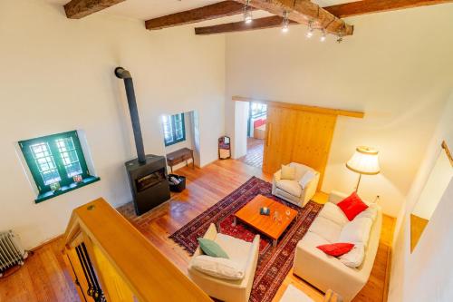 an overhead view of a living room with a fireplace at Mühle in der Pferdewelt Reichenau in Reichenau