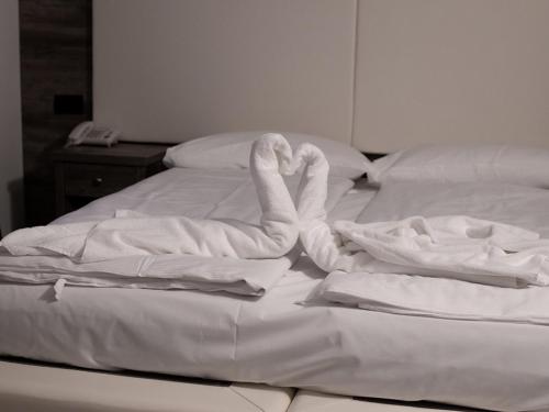 Postel nebo postele na pokoji v ubytování Hotel De Nac