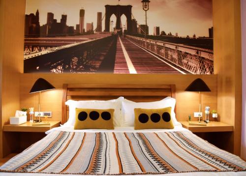 a bedroom with a large bed with a picture on the wall at South Island 206 in Hengchun