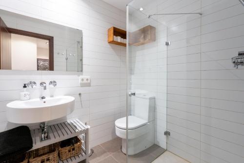 A bathroom at POC A POC SUITES