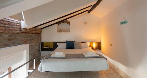 Posteľ alebo postele v izbe v ubytovaní JOIVY Cosy Apt in Como Centre