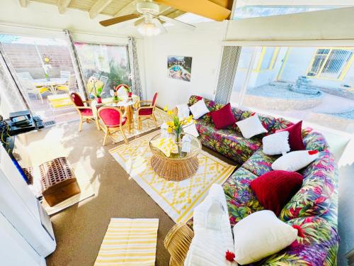 a living room with a couch and a table at A PLACE IN THE SUN Hotel - ADULTS ONLY Big Units, Privacy Gardens & Heated Pool & Spa in 1 Acre Park Prime Location, PET Friendly, TOP Midcentury Modern Boutique Hotel in Palm Springs