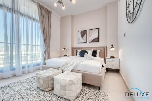 Postel nebo postele na pokoji v ubytování Welcoming 1BR at Prime Views Meydan by Deluxe Holiday Homes