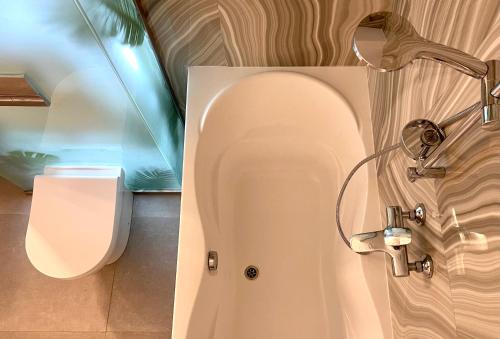 a bathroom with a shower and a toilet at Logvinenko apartment in Bishkek