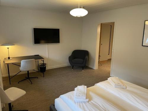 Ένα ή περισσότερα κρεβάτια σε δωμάτιο στο Hotel Nørrevang