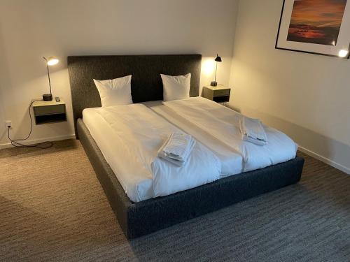 Ένα ή περισσότερα κρεβάτια σε δωμάτιο στο Hotel Nørrevang