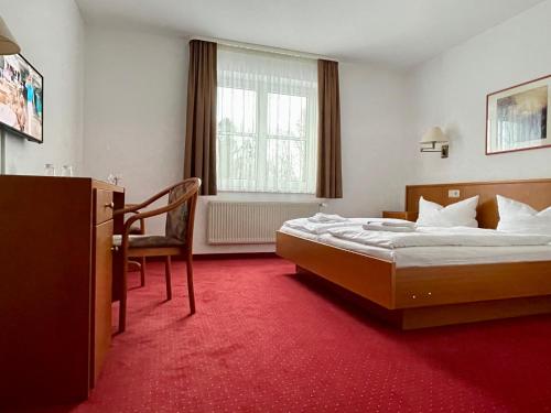 Ліжко або ліжка в номері gut-Hotel Pommernhotel Barth