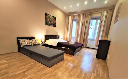 Posteľ alebo postele v izbe v ubytovaní Abak Krakow Apartment