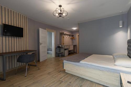Una televisión o centro de entretenimiento en Milana SPA & Hotel - SPA included