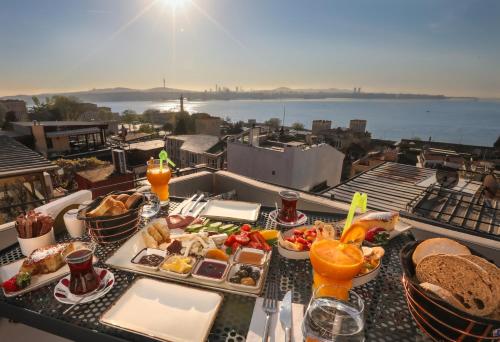 a tray of food on a table on a balcony at Henna Hotel Istanbul in Istanbul