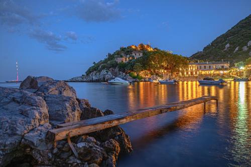 a view of a body of water with boats in it at Cleopatra's Miramare in Damouchari
