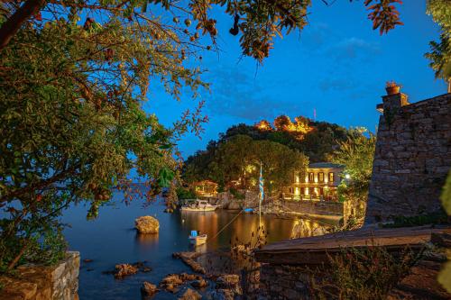 a view of a river at night at Cleopatra's Miramare in Damouchari