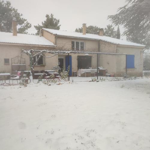a house with snow on the ground in front of it at La Margottière chez isa et titi in Rians