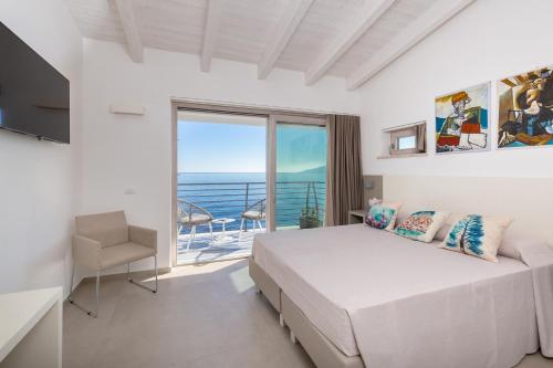 Postel nebo postele na pokoji v ubytování Hotel Caramare