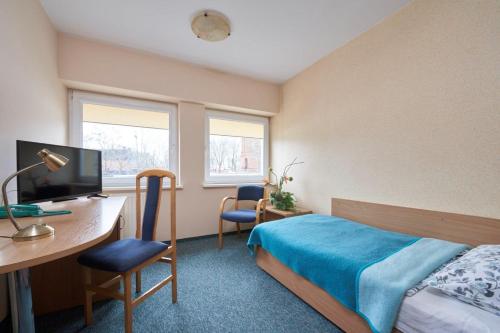 Televízia a/alebo spoločenská miestnosť v ubytovaní Hostel Relaks
