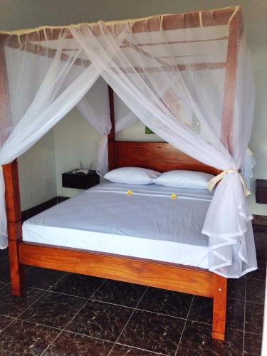 Кровать или кровати в номере Alur Beach Homestay