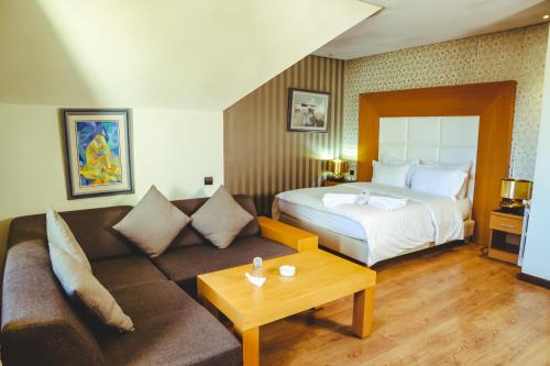 Postel nebo postele na pokoji v ubytování Hotel Perce Neige