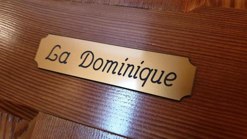 a sign that says go dominate on a wooden table at Le Prangeleux in Tenneville
