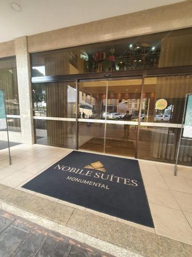 a welcome mat in front of a building at Flat Nobile Suítes Monumental By Rei dos Flats, in Brasilia