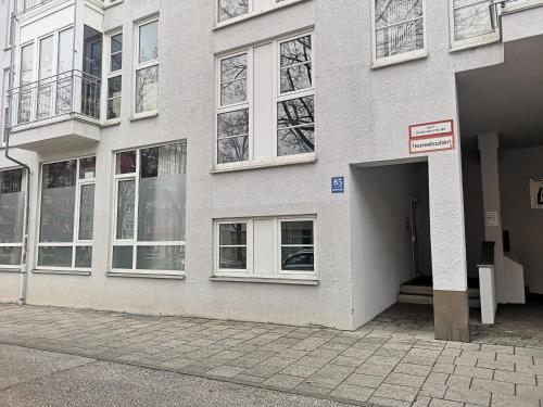 a building with an open door on a street at HOMELY STAY Studio 6 - Your Comfortable Self-Check-In Studio in Munich - 15 min from Oktoberfest in Munich