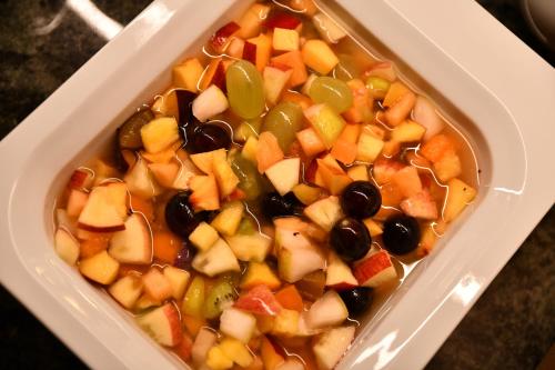 a plastic container of food with fruit and vegetables at Garni Hotel Bel Vert in Selva di Val Gardena