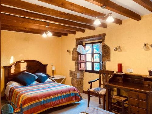 Ліжко або ліжка в номері Casa Rural Molino de Luna