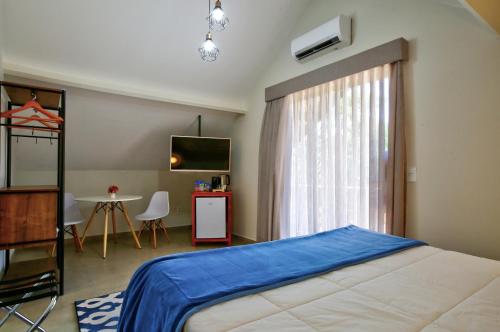 Postel nebo postele na pokoji v ubytování Filimahalo Hotel